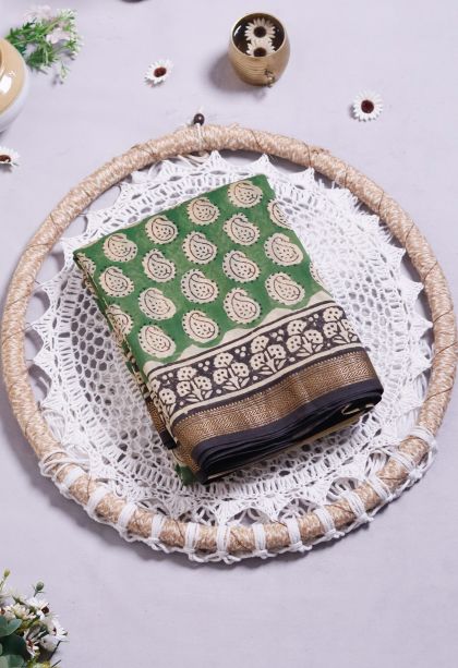 Designer Lightweight Saree in Green with Elegant mustard yellow paisley patterns.